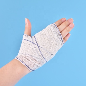 Absorbent elastic crepe bandage with blue/red line