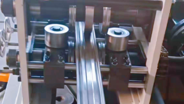 Storage shelf buckle beam profile roller press