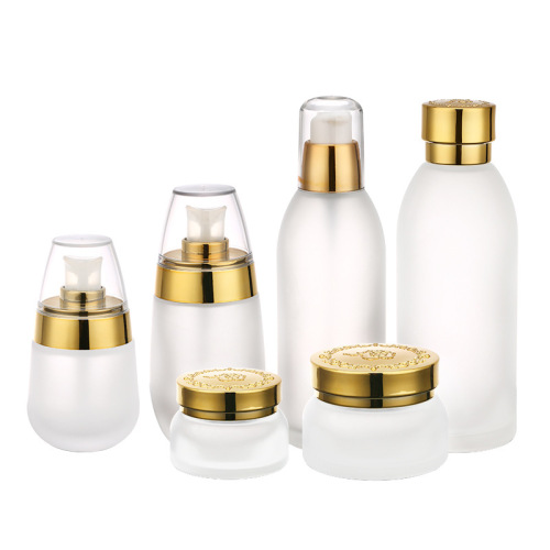 Botellas cosméticas de cristal talladas en oro con tapa de ABS