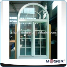 Solid wood arched double tilt and turn grill window with true mullion