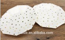 White color decagon shape paper plate with many small gold color stars