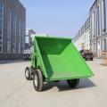 Wheeled dump truck material carrier