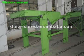 Vibratory conveyor in tire recycling plant