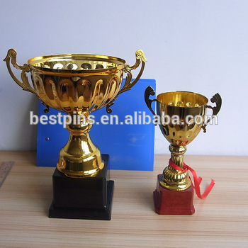 metal awards golden trophy cup with wooden base