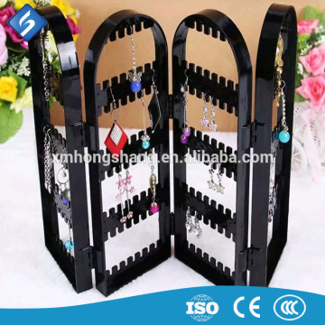 Folded Clear Acrylic Jewelry Earrings Display Stand in the Boutique