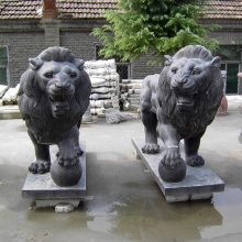 Wholesale large outdoor black stone walking pairlionstatuewithball sculpture