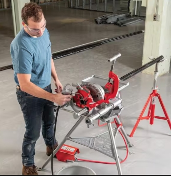 Pipeline slotting and threading machine