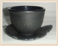 cast iron tea cup with plate