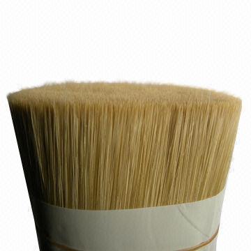 Man-made hollow bristle with PET/PBT filament