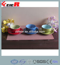 glazed ceramic cup and saucer