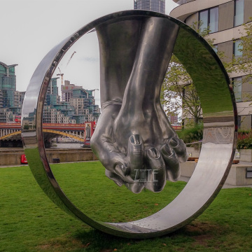 Outdoor metal casting bronze circle sculpture of holding hands statue