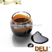 Black concentrated sugar cane molasses