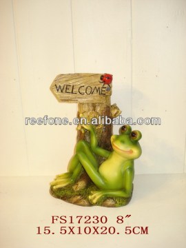 Resin Frog figurine on beach