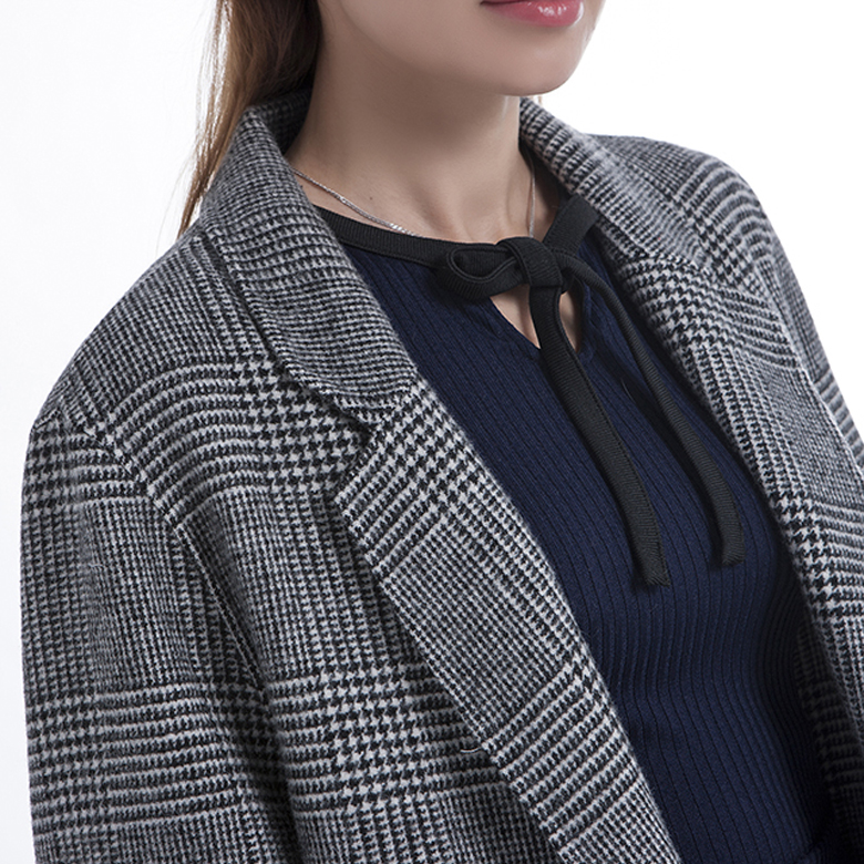 The collar of fashionable striped cashmere overcoat