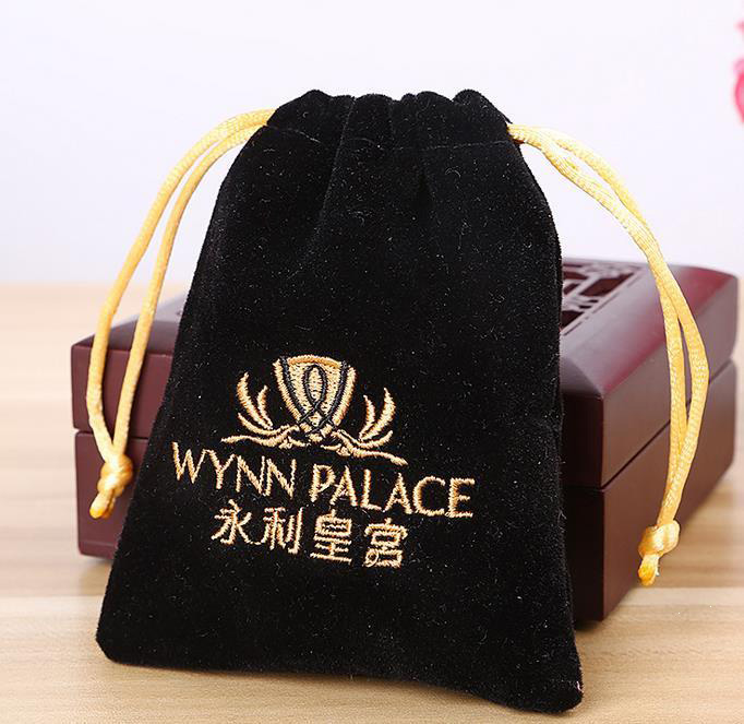 Black embroidery pouch with gold string