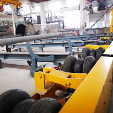 Roller pile transfer conveyor