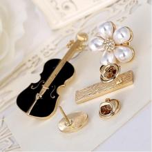 Small fancy brooches and pins for dresses