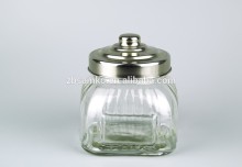 Fine transparent glass candle holder with silver tin lid