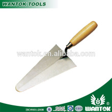 Bricklaying trowel with wooden grip, construction tools
