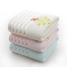 the bath towel with embroidery peacock feathers