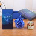 Benutzerdefinierte blaue Klapperchen -Geschenkkasten Kerze