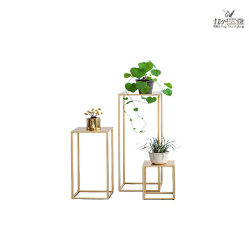 Golden wrought iron flower stand