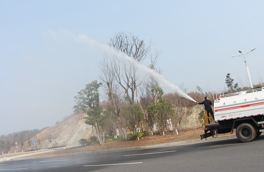 water spray truck in action 4