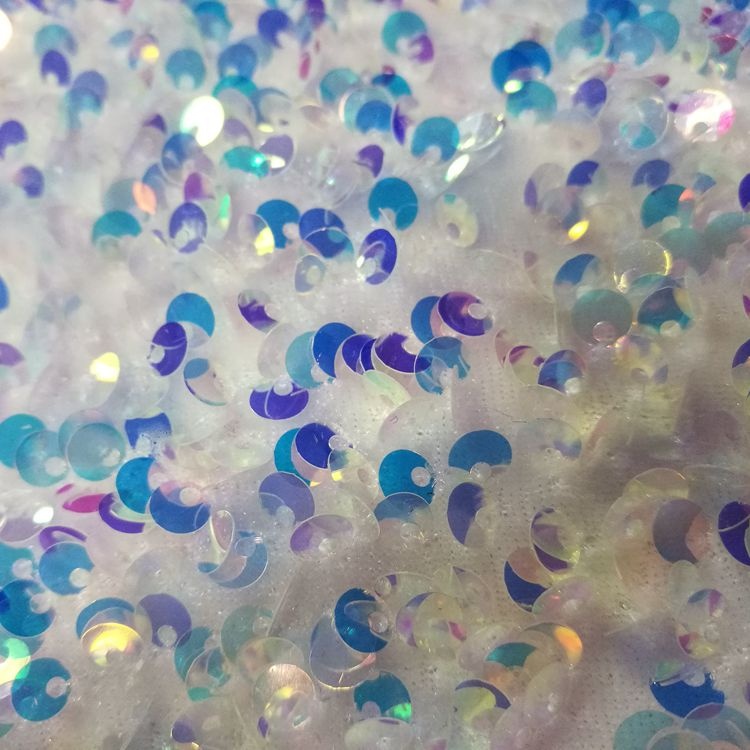 Tessuto per indumenti ricamato con paillettes iridescenti in velluto fantasia