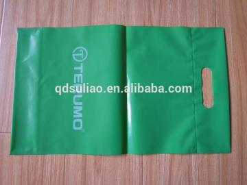 green plastic die cut shopping bag with logo