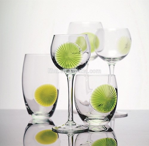 Hand blown engraved green balloon wine glass