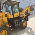 Traktor artikulasi roda dengan loader dan backhoe