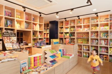 wood mounted shelf and display tables for book shop interior design