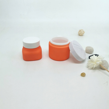 Orange glass jar with white lids