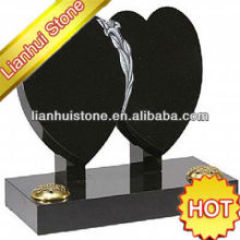 upright black double heart headstone