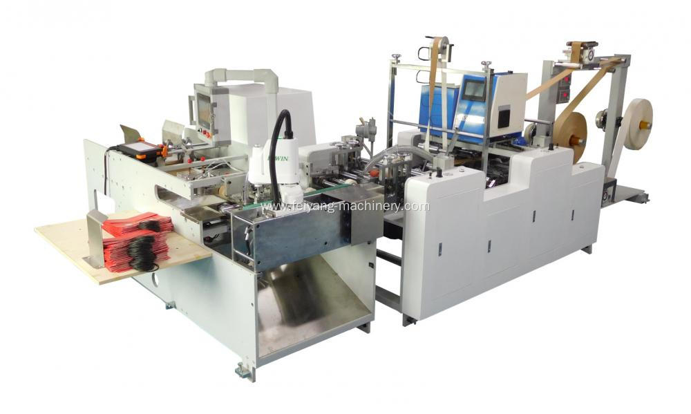 Handle pasting machine for paper bags