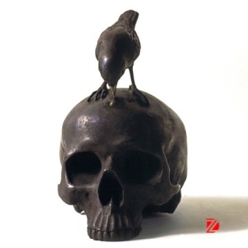 Bronze skull statue with bird sculpture for decoration