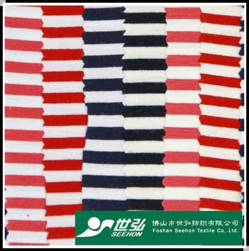 red, white, black and blue striped fabric