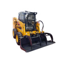 Mini loader berdiri di atas skid steer dengan ember