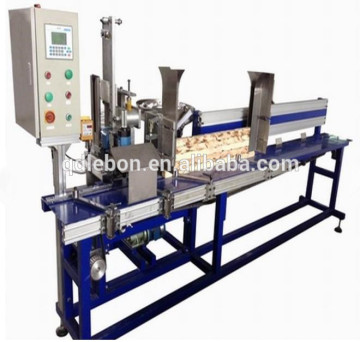 Automatic pinning hook machine for sofa making