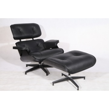 Sillón Eames de contrachapado negro e otomán