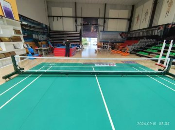 Movable pickle ball post