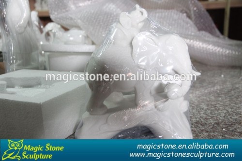 small white marble elephant statues