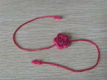 Pink paper tags with string