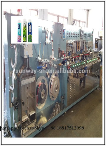 Plastic tube extruder