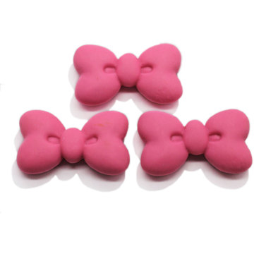 Bonita pajarita de resina cuentas de cabujón DIY encantos Bowknot niños horquilla adorno diadema accesorio funda para teléfono decoración artística