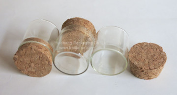 Small glass jewelry packaging container with cork stopper