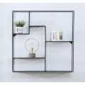 Metal wall-mounted shelf for interior decoration