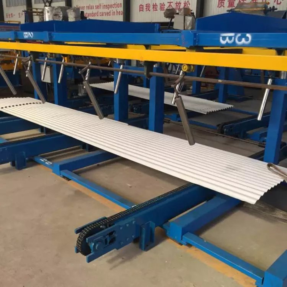 Automatic sheet stacker for roll forming machine