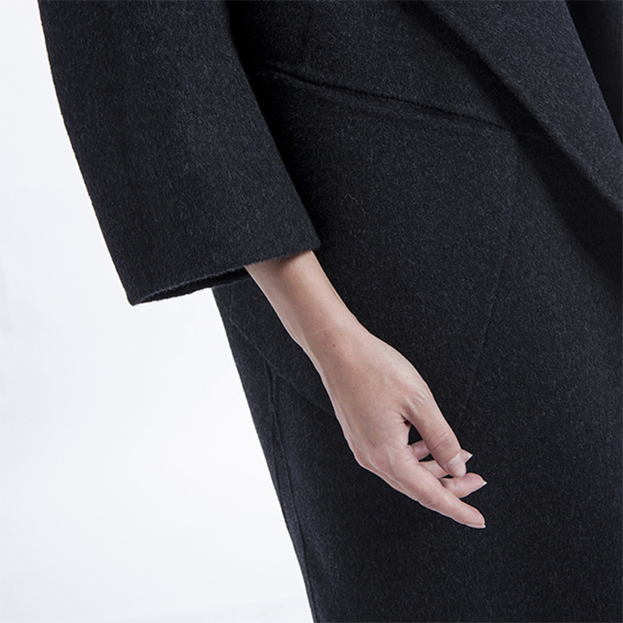 Sleeves of long black cashmere jacket