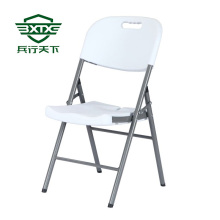 White plastic folding chair
